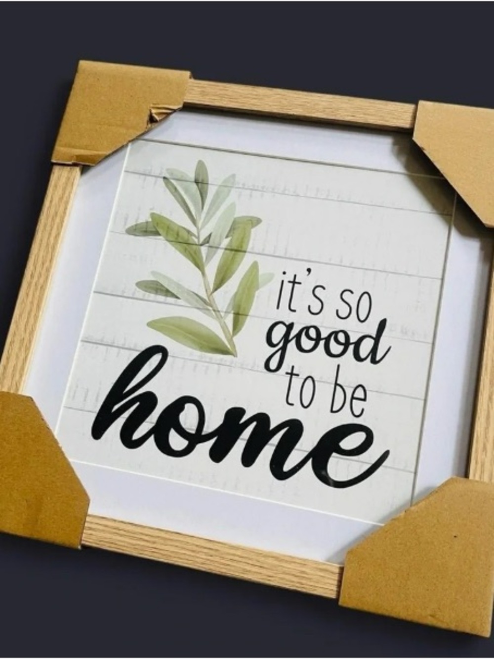 Framed sign with text 'it's so good to be home'